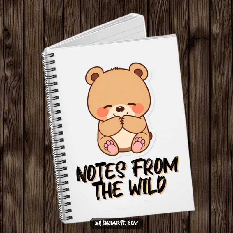 Funny notebook cover displaying a small, round bear cub bowing happily with paws together, inspiring note-taking.